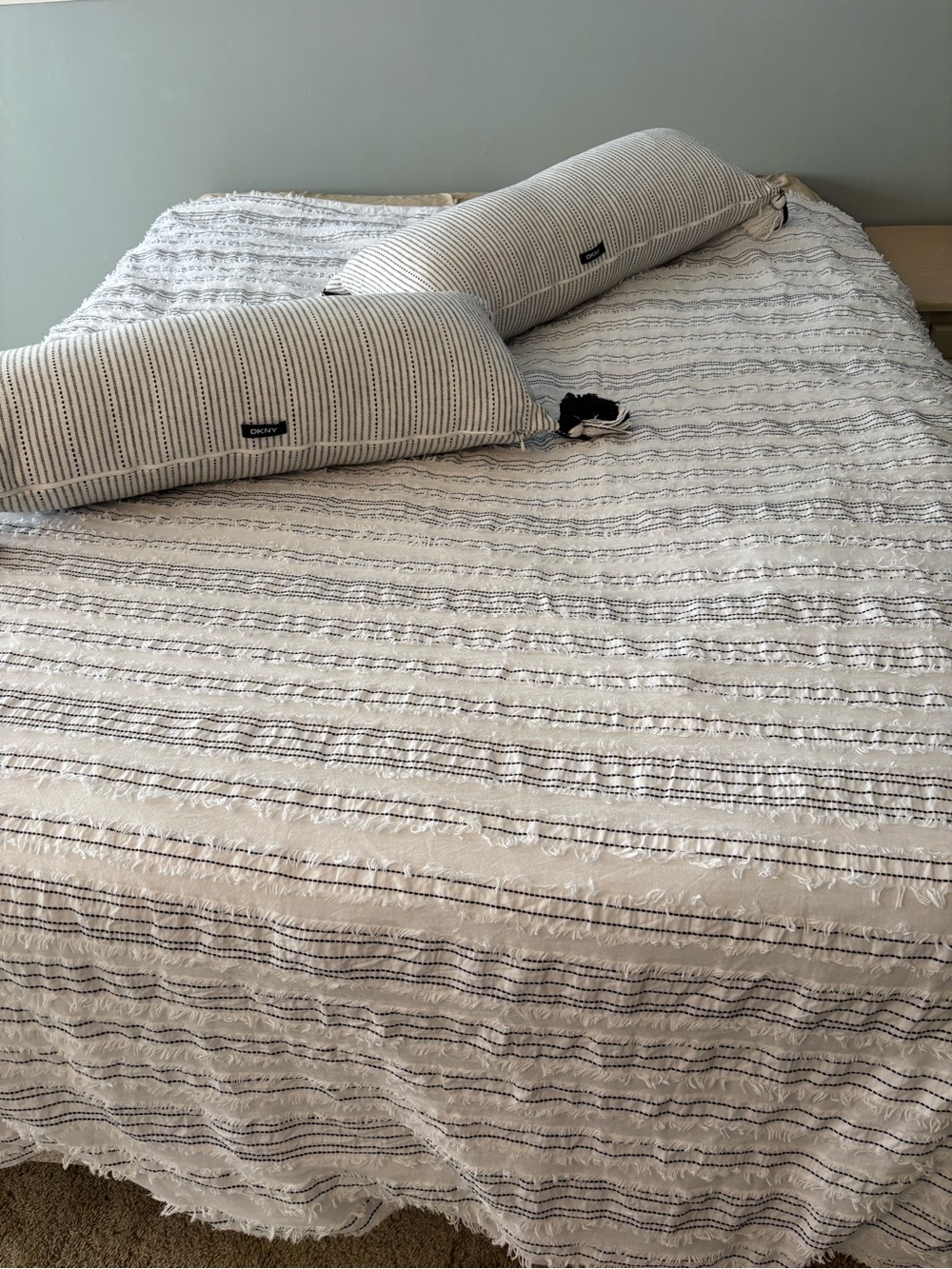DKNY White Bedspread with Black Striped Bolster Pillows